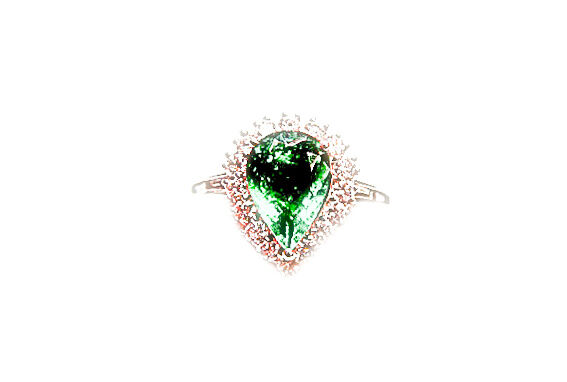 1 PEAR CUT EMERALD SET WITH ROUND BRILLIANT AND SIDES